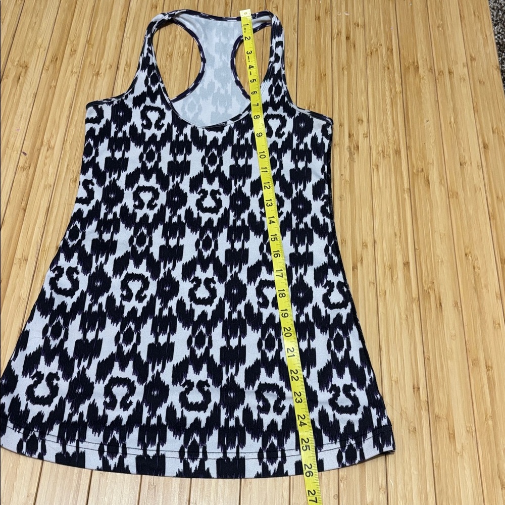 Lululemon tank top. No tag. Measures a size 4. White,black and purple. - Picture 7 of 7